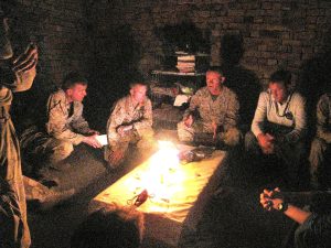 Lt. Gen. Larry Nicholson and Kael Weston sitting in the dark